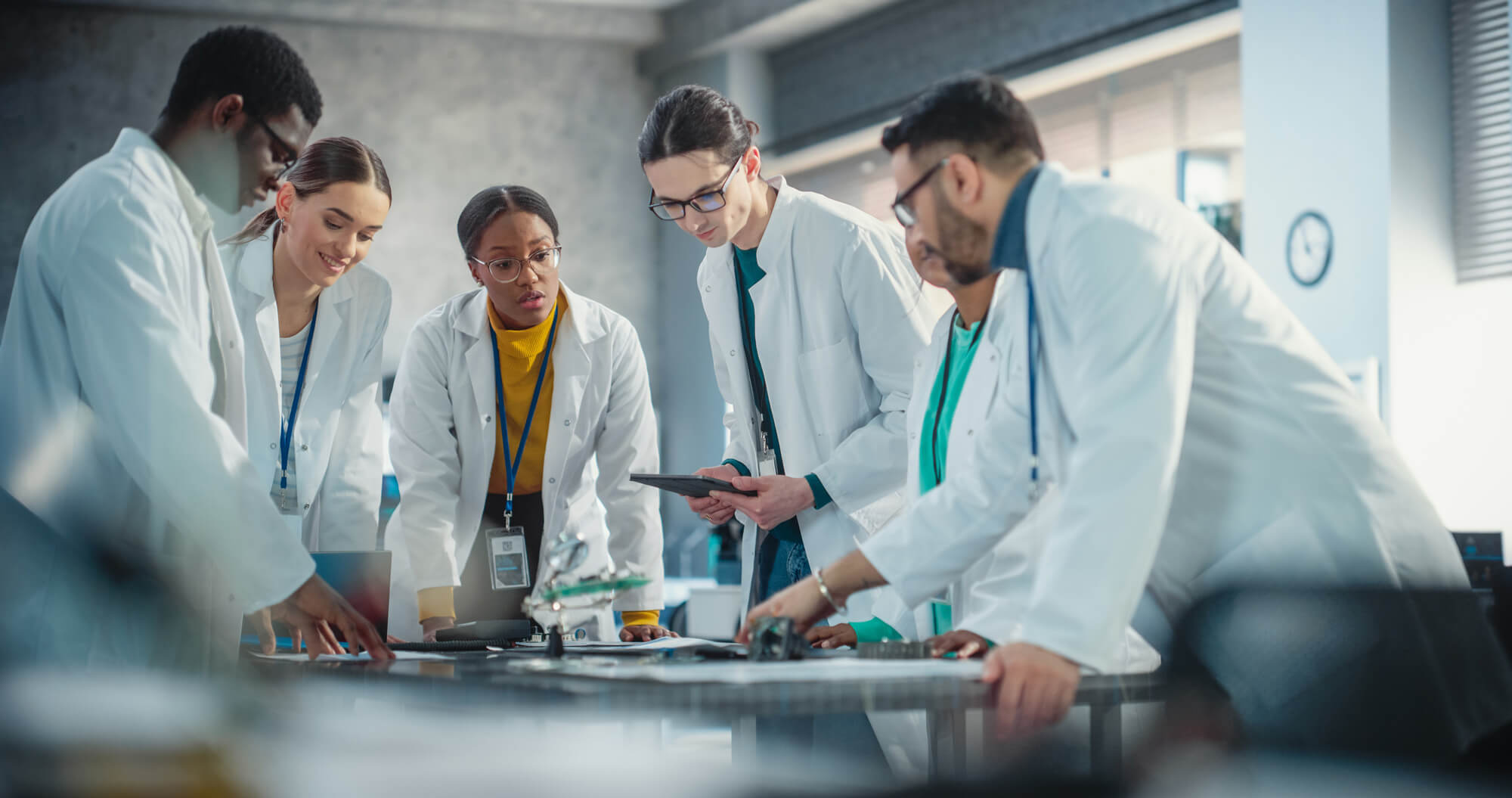 Group of scientists discussing research and dating projects during a team meeting