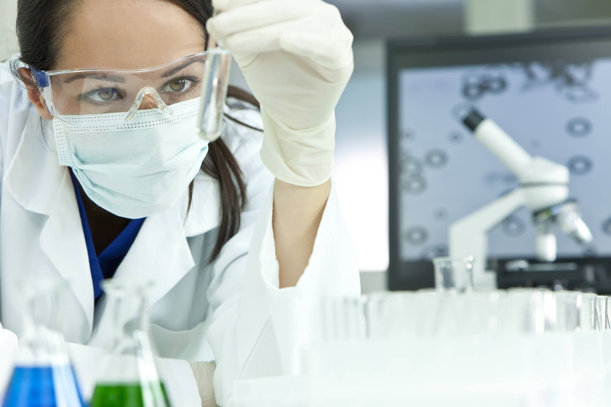 Scientist observing a prepared sample in a modern laboratory
