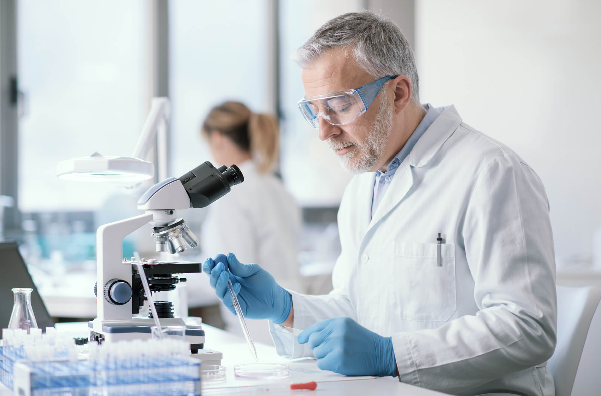 A scientist preparing a sample for laboratory dating analysis